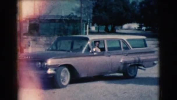 Man riding on his car by street — Stock Video