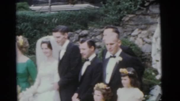 Bride and groom with wedding guests — Stock Video