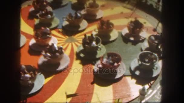 People sitting in cup attraction — Stock Video