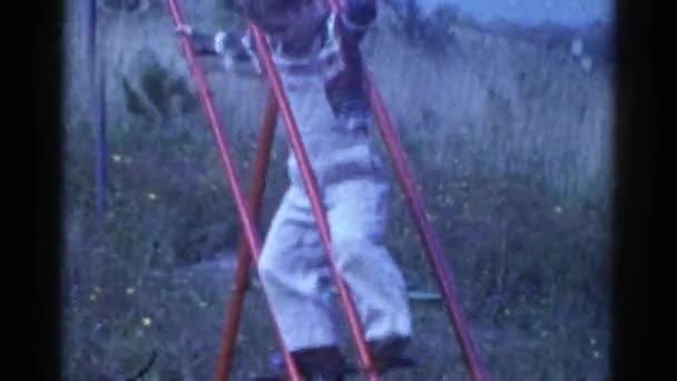 Kid playing on swing — Stock Video