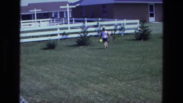 Boy running for balloon in backyard — Stock Video