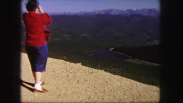 Woman admiring mountain landscape — Stock Video