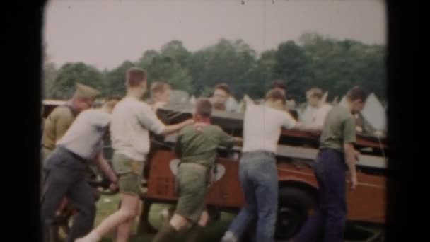 Boy scouts pushing trailer — Stock Video