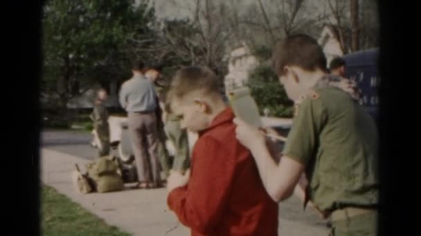 Boy scout writing in notebook — Stock Video