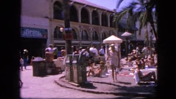 People walking and relaxing on sandy beach — Stock Video