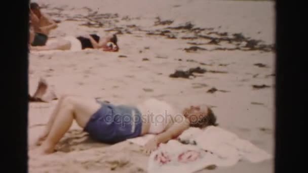 People lying on beach — Stock Video