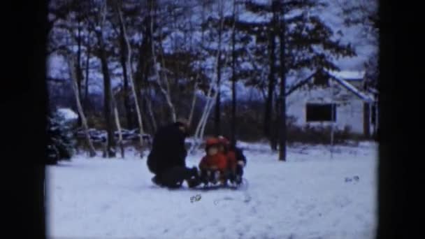 Kid sledging with father — Stock Video