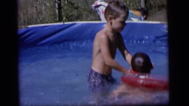Boys playing in pool — Stock Video