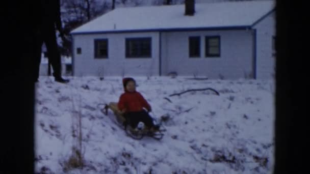 Kid sledging with father — Stock Video