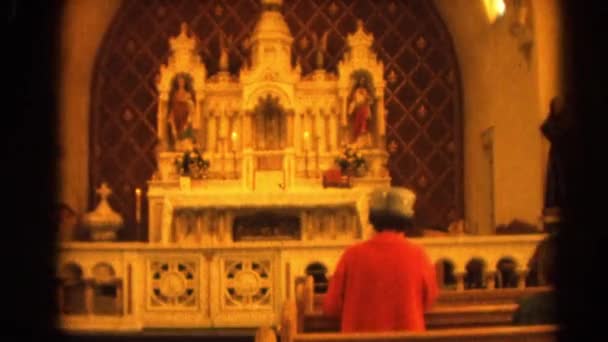 Woman praying before church altar — Stock Video