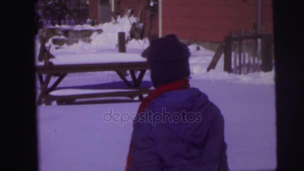 Small boys shovel snow and play — Stock Video