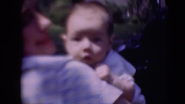 Woman holding infant baby — Stock Video