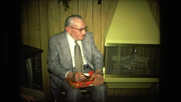 Men in suits sitting around a fireplace — Stock Video