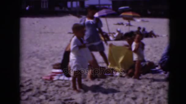 Big family on sandy beach — Stock Video