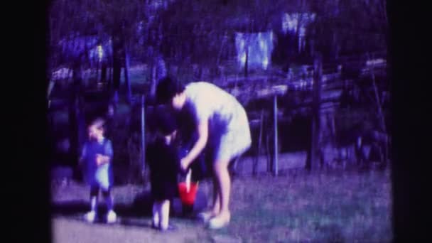 Kids with bucket and woman — Stock Video