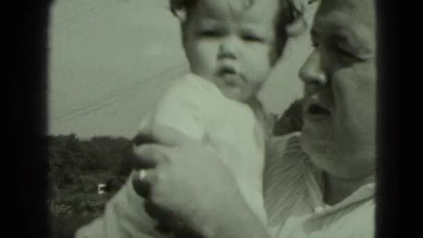 Man holding little girl in hands — Stock Video