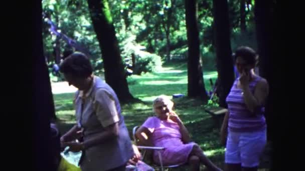 Ladies chatting joking with one another at a outdoor park — Stock Video