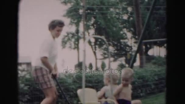 Mom pulling cart with children — Stock Video