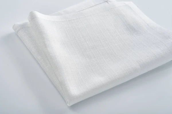White linen napkin on a white table — 스톡 사진