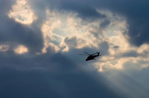 Silhouette of a helicopter in the sun — Stock Photo, Image