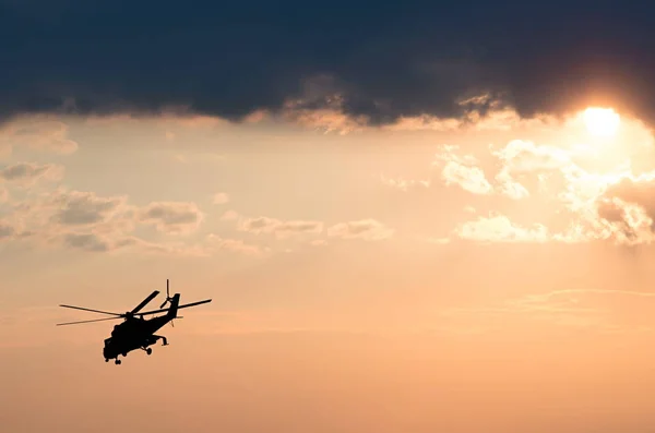 Silhouette of the helicopter on the sunrise background — Stock Photo, Image