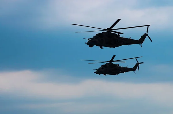 Two silhouettes combat helicopters — Stock Photo, Image