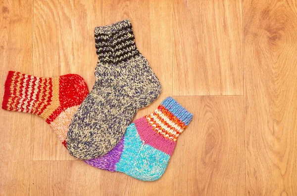 Wool colored socks on a wooden background — Stock Photo, Image