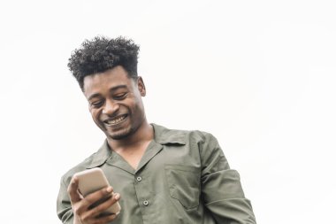 smiling young african black man looking the phone