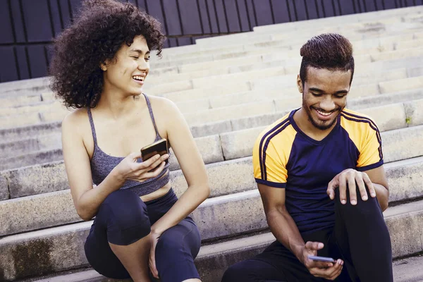 athletic latin woman smiles happy with sports man