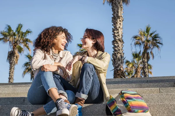 Young multiracial couple women and laughing — Stock fotografie