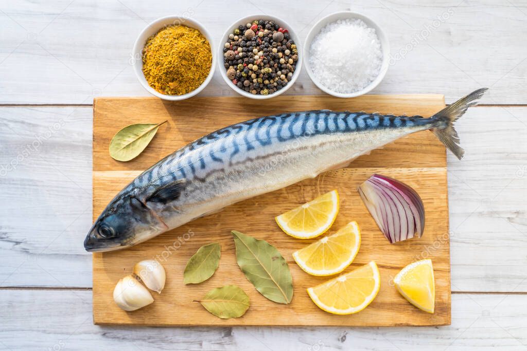 Fresh raw mackerel fish with cooking ingridients