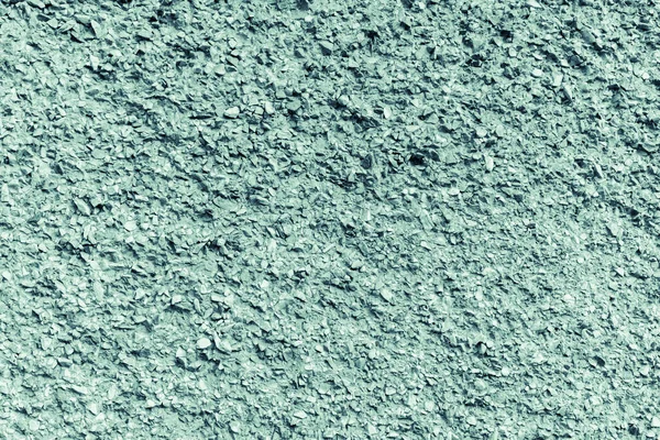 瓦礫の石で覆われた壁の質感 抽象的な背景 汚れたグランジーグリーンで着色された色 ストックフォト — ストック写真