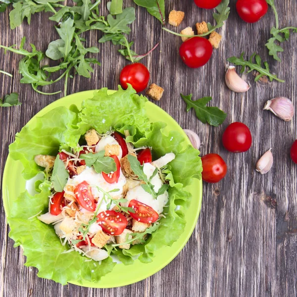 Caesar salad and fresh tomatoes — Stock Photo, Image