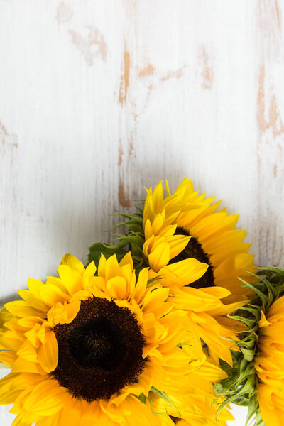 Yellow Sunflower Bouquet on White Rustic Background