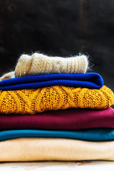 Stack of colorful warm autumn and winter clothes — Stock Photo, Image