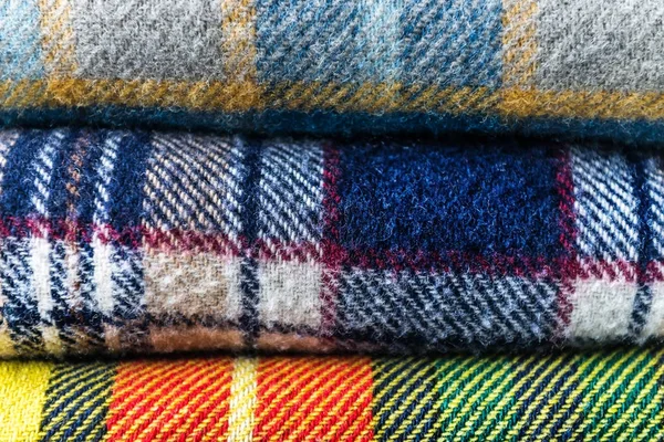 Stack of woolen checked blankets — Stock Photo, Image