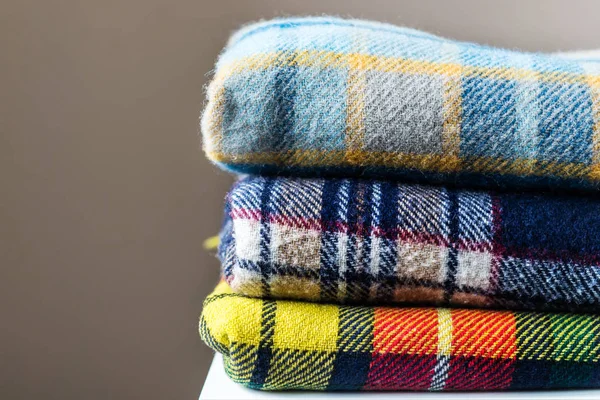 Stack of woolen checked blankets — Stock Photo, Image