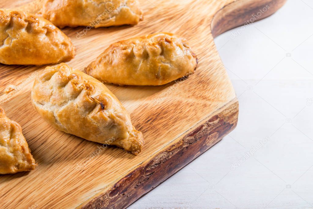Hot pasties from butter enriched puff pastry filled with minced 