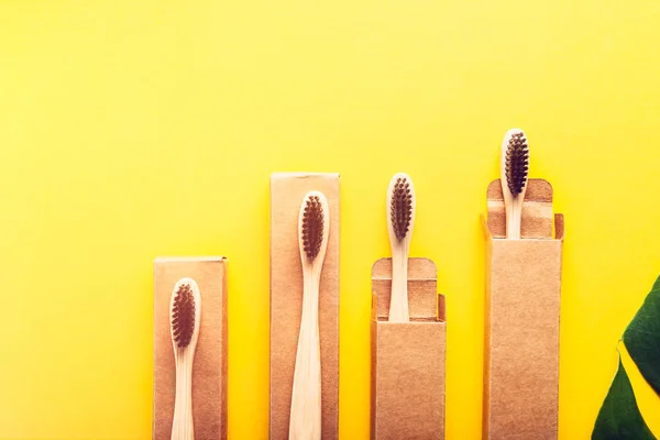 A family set of four wooden bamboo toothbrushes — Stock Photo, Image