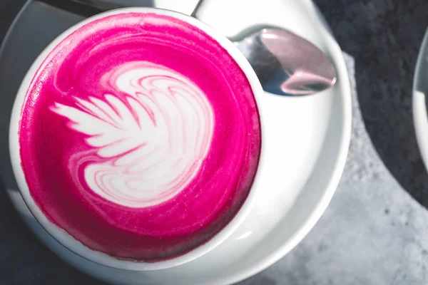 Cup of pink matcha latte on the table in the cafe — Stock Photo, Image