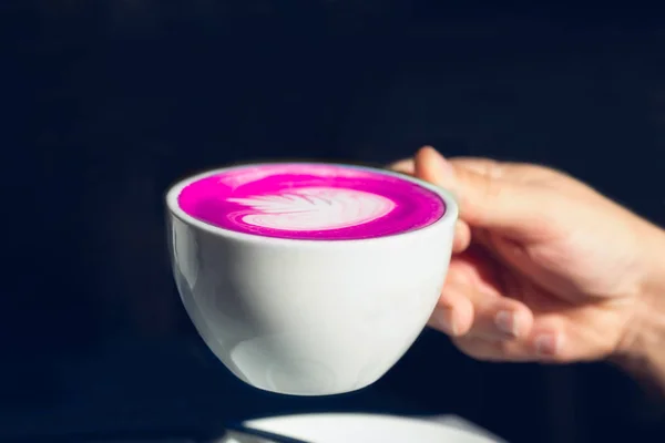 Cup of pink matcha latte on the table in the cafe — Stock Photo, Image