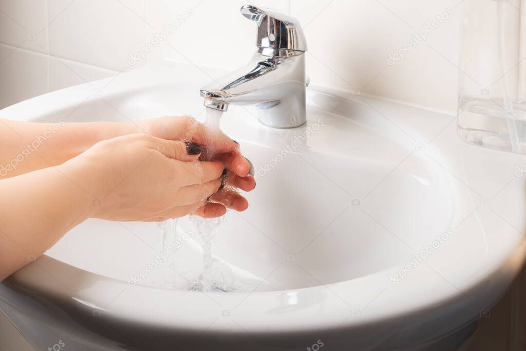 Woman is washing hands