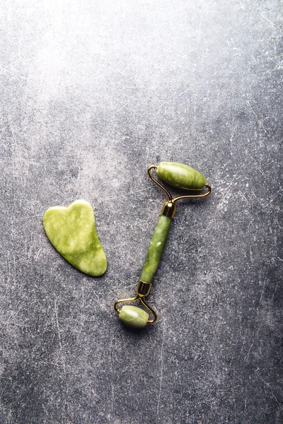 Jade face roller and Gua sha stone — Stock Photo, Image