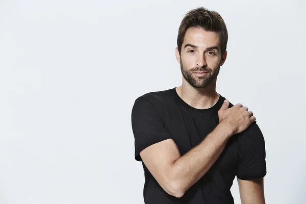 Handsome man in black t-shirt — Stock Photo, Image