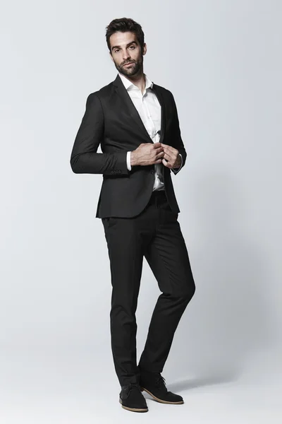 Handsome man in black suit — Stock Photo, Image