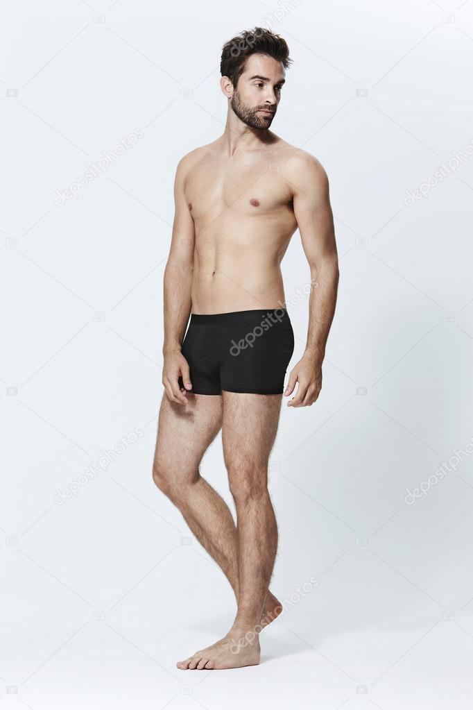 Handsome bearded man in shorts