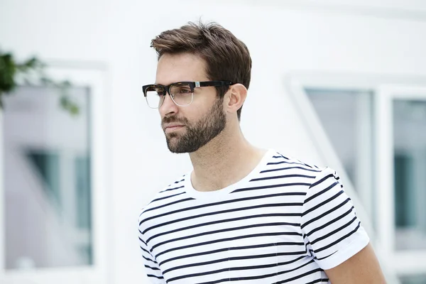 Serious handsome man in striped t-shirt — Stock Photo, Image