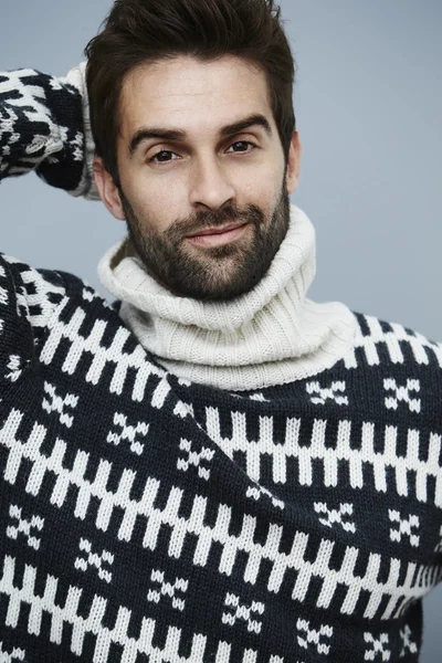 Smiling man in woolen sweater