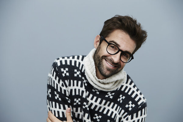 Handsome laughing man in sweater 
