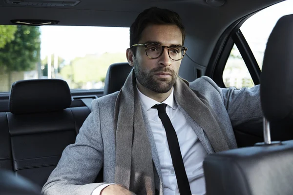 Handsome businessman in car — Stock Photo, Image